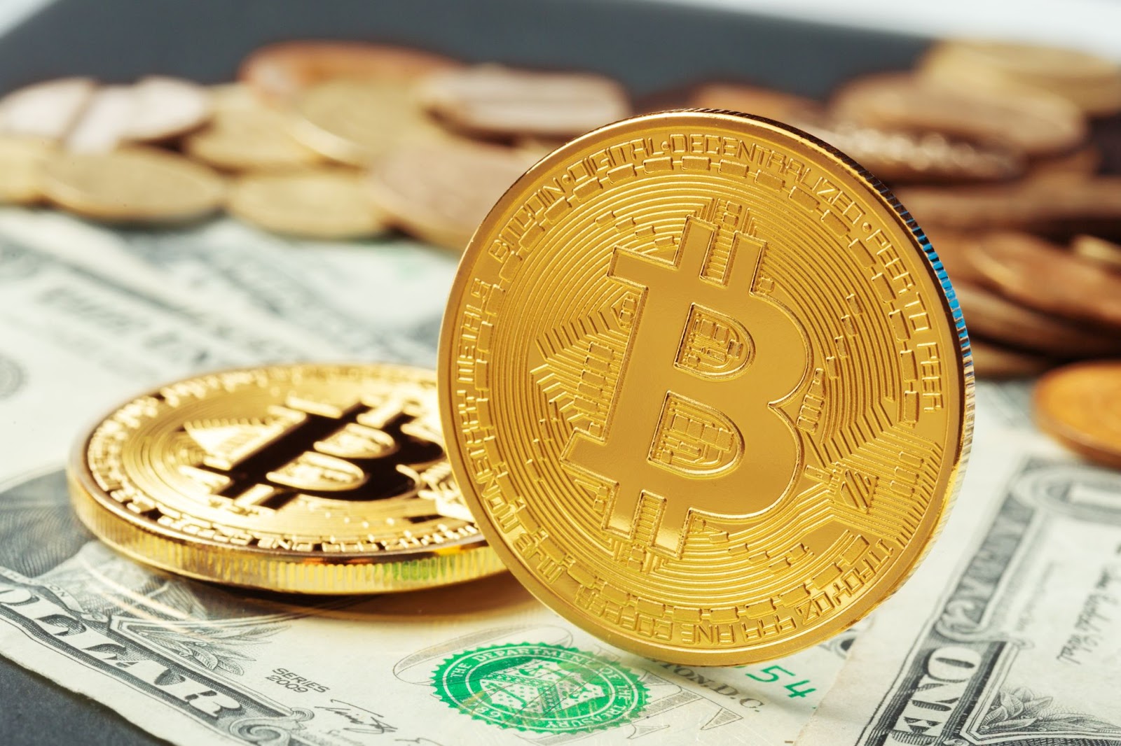 Close up of bitcoin and dollar