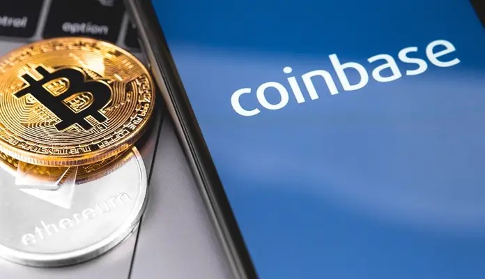 Smartphone with the inscription coinbase with crypto coins